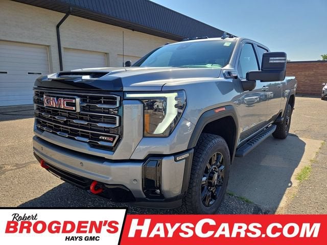 2026 GMC Sierra 2500 HD AT4 in Sterling Metallic — front three-quarter view