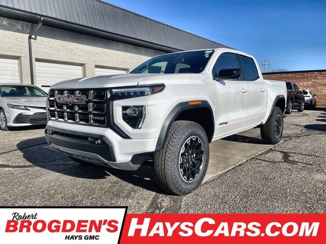 2026 GMC Canyon AT4 in Summit White — front three-quarter view